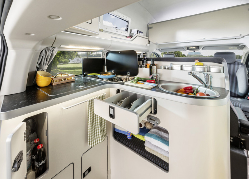 Illustration for article titled This Ingeniously Packaged Camper Packs Four People In A Tiny Van